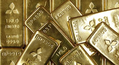 Золото подешевело на новостях по госдолгу США