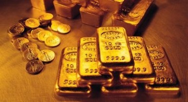 Золото незначительно дешевеет после роста в предыдущие дни