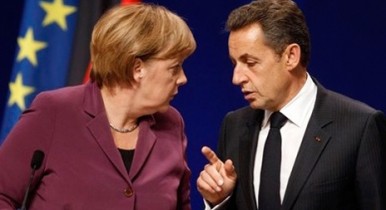 Образы 2011, кризис евро, Меркель и Саркози.