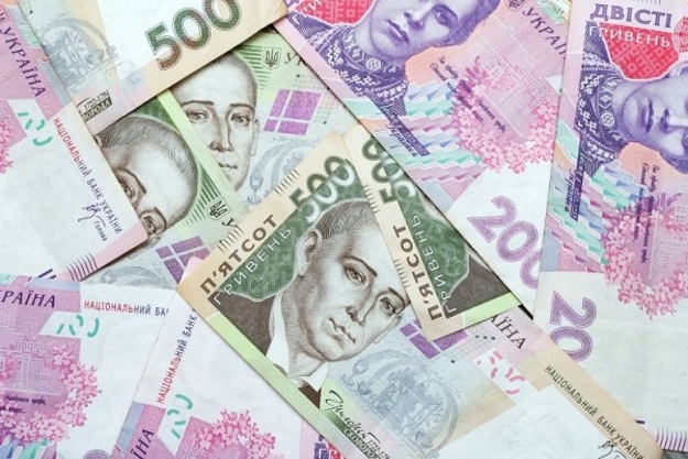 Национальный банк понизил официальный курс гривны на 16 копеек до 27,18/$.