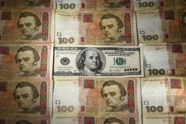 Национальный банк понизил официальный курс гривны на 2 копейки до 26,50/$.