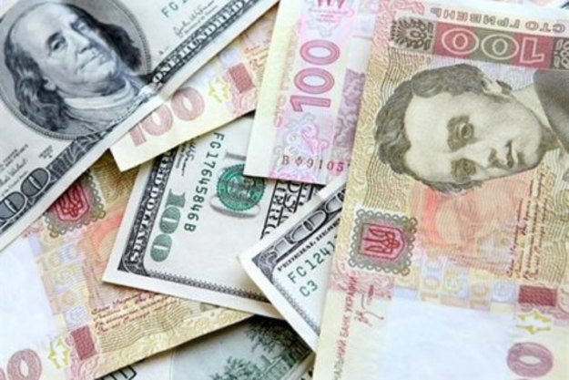 Национальный банк понизил официальный курс гривны на 2 копейки до 26,50/$.