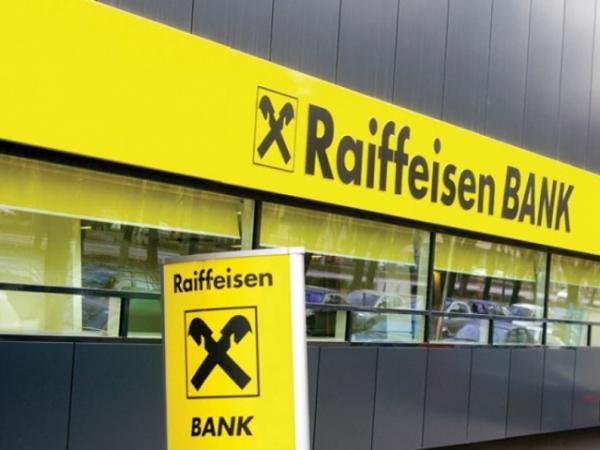 Австрийская банковская группа Райффайзен прекращает обмен наличной гривны на иностранную валюту за пределами Украины.