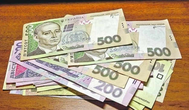 Национальный банк понизил официальный курс гривны на 3 копейки до 26,35/$.
